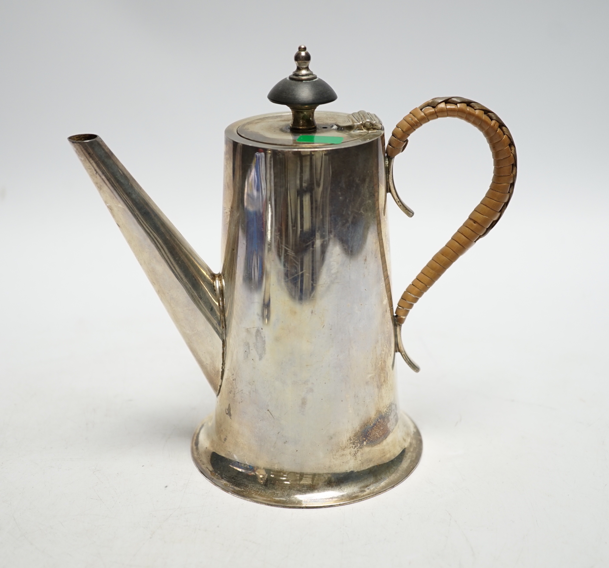 A George VI silver hot water pot, with rattan handle, Walker & Hall, Sheffield, 1937, height 15.7cm, gross weight 10.2oz.